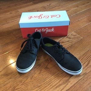 Black tennis shoe style sneakers